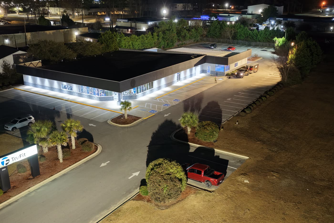 Drone view of a finished lot lit up at night